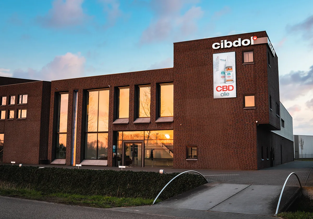 The Cibdol building in the Netherlands, with the Cibdol logo and CBD oil banner on the facade